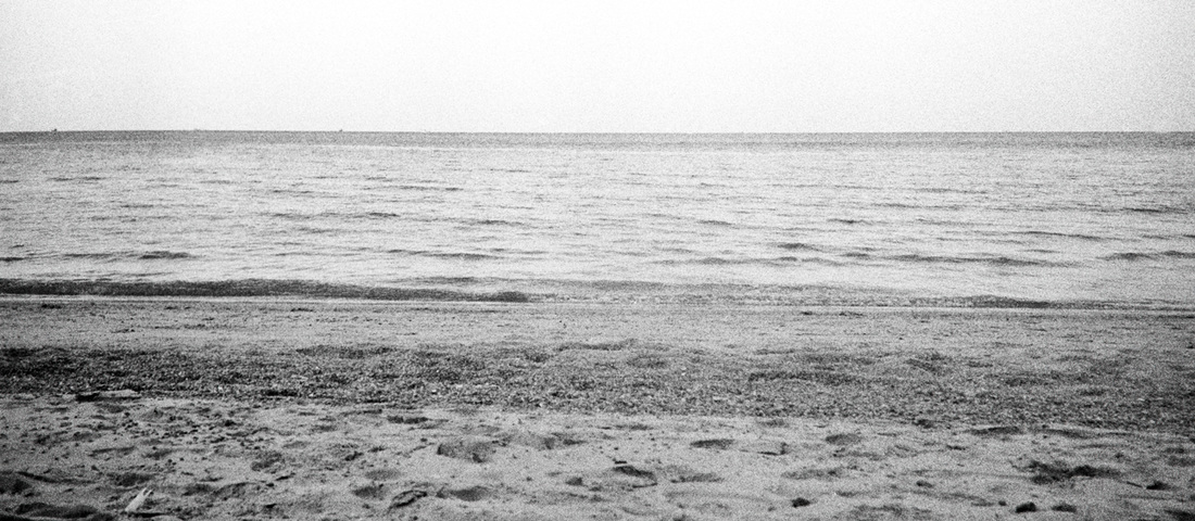 Black and white photograph of a flat sea horizon, Gulf of Thailand